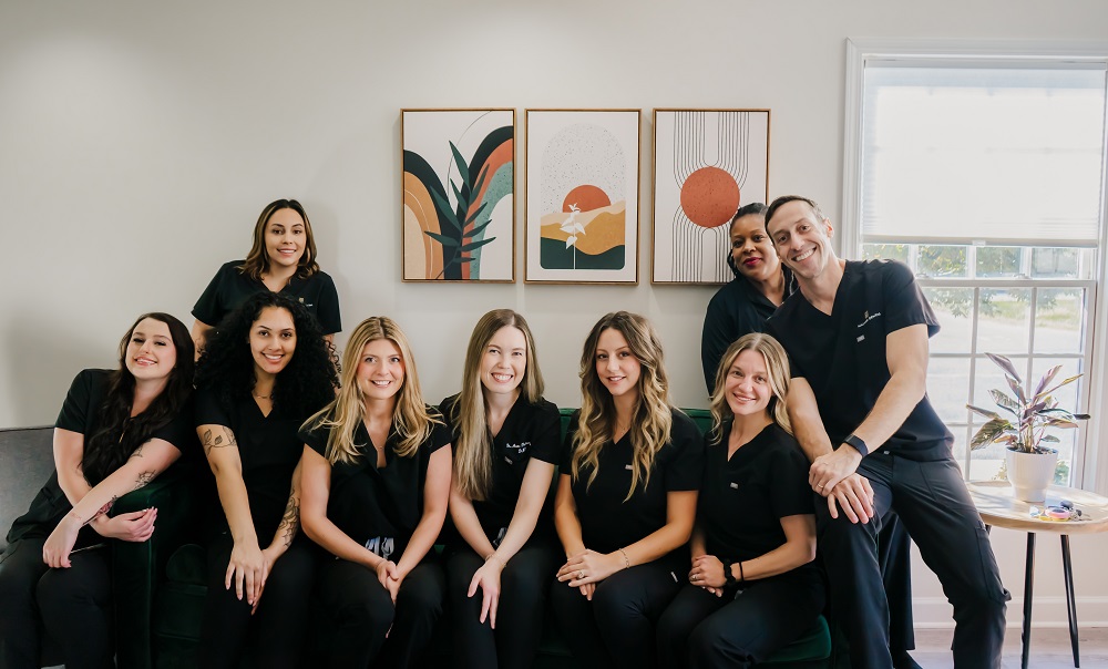 Dentist Dr. David Donelson with full staff team at Hallmark Dental