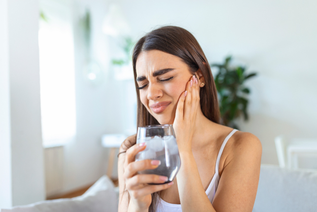 Emergency dentist in Austin TX treating patient with severe tooth pain in dental clinic