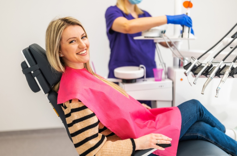 Professional teeth whitening treatment in Austin TX with patient smiling in dental chair