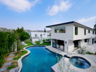 Geometric luxury pool with swim lane and golf course views