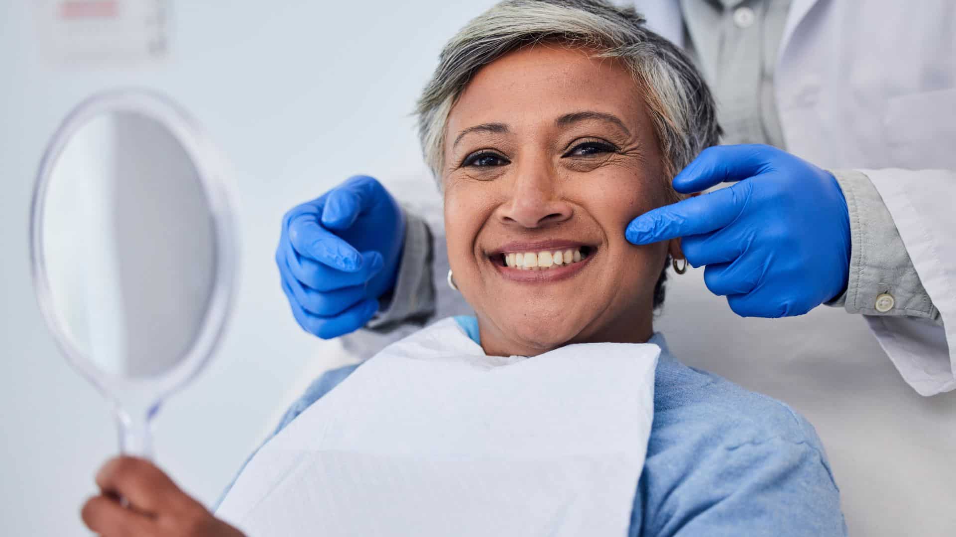 a older women happy after received dental bonding treatment at In Smyle Dental