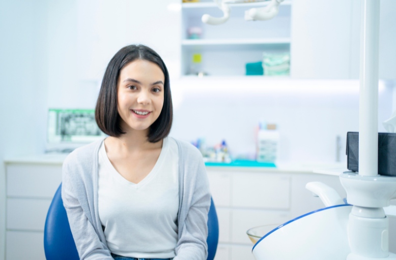 Patient receiving dental care in Joplin for early detection and treatment of root canal infection to protect overall and heart health