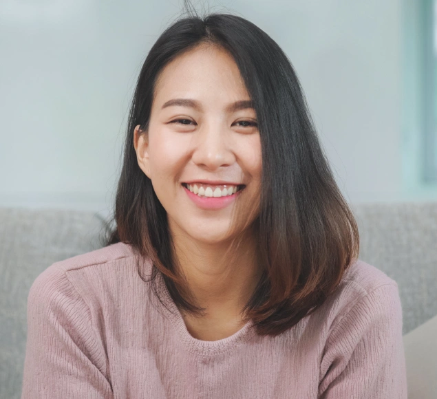 Woman smiling brightly after dentures and partials treatment at Lilburn Smile Makers Dental in Lilburn, Georgia