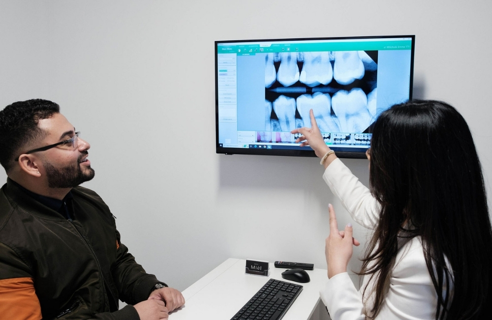 patient and dentist reviewing an xray at Miel Dental Aesthetics in Peabody MA