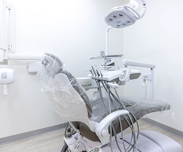 modern dental exam room with chair and equipment