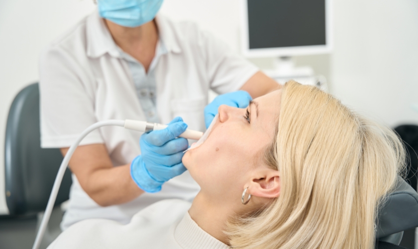 Dentist injecting anesthetic into a patient's gum tissue