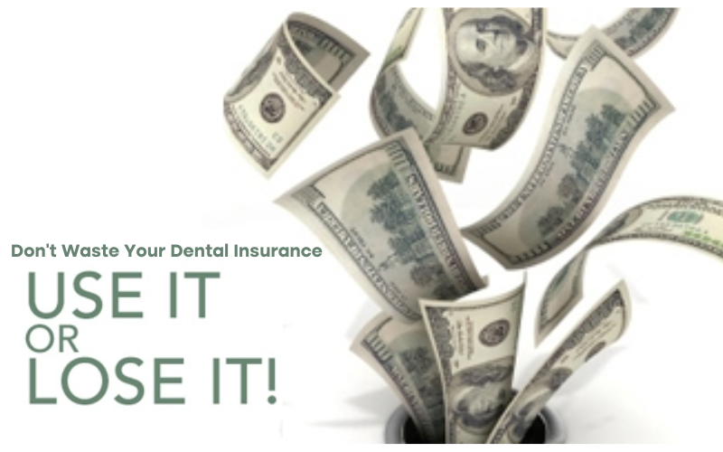 Dollar bills flying in the air next to a dental insurance document