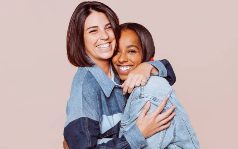 Friends smiling together at a dental office