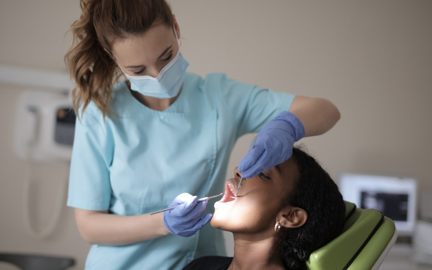 Young patient being examined by a dental professional during an emergency visit
