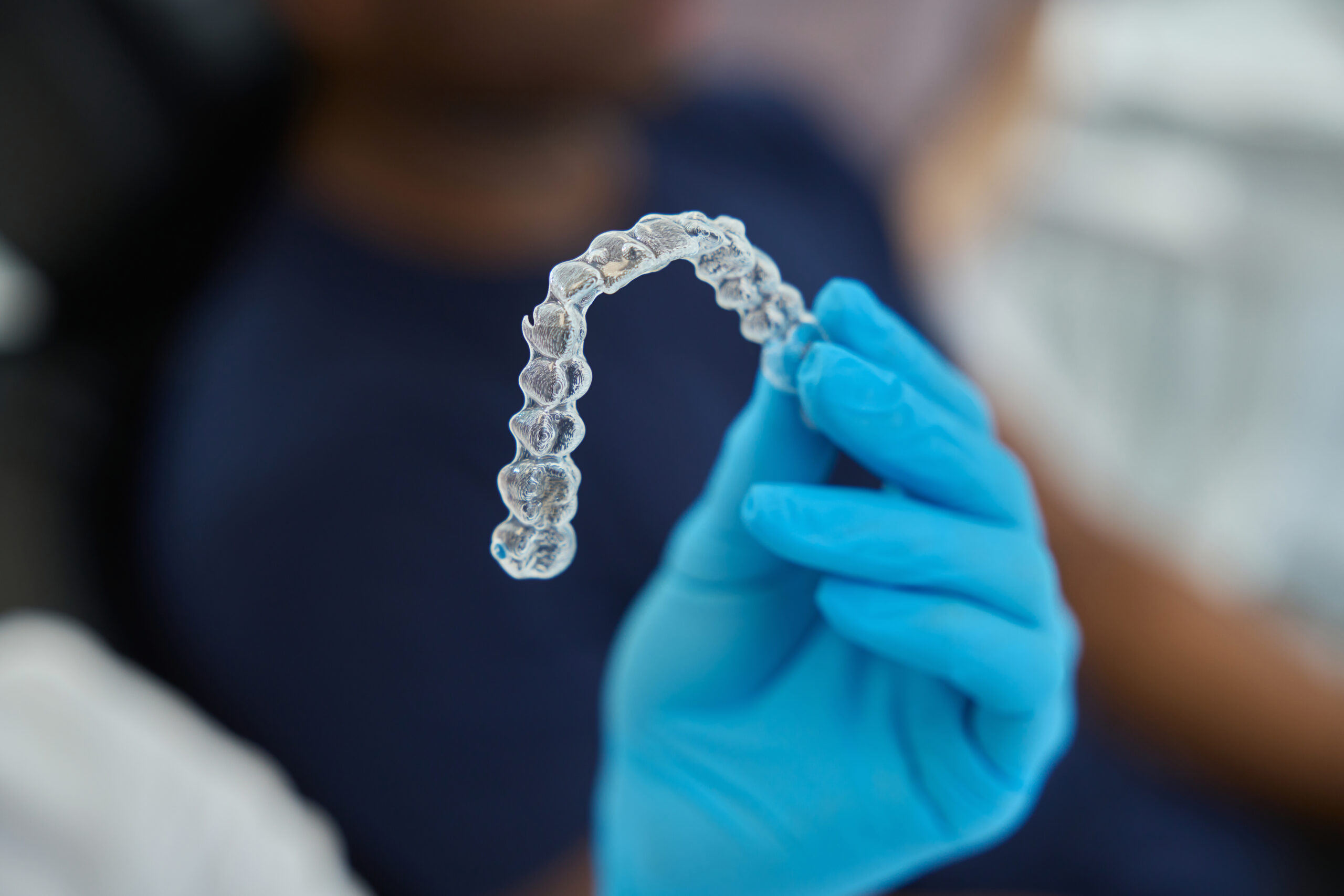 Clear Invisalign aligner trays for teen orthodontic treatment
