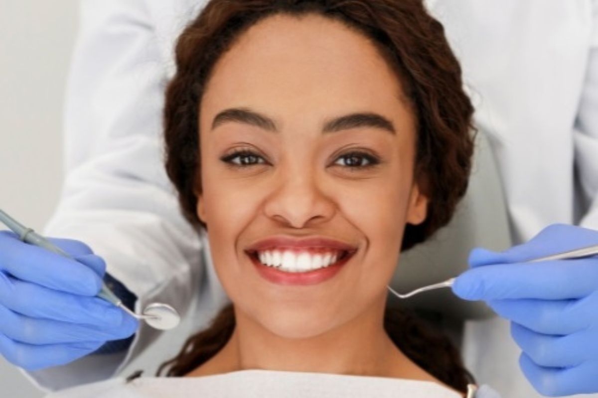 Woman smiling brightly as a holistic dentist patient in Hayden ID