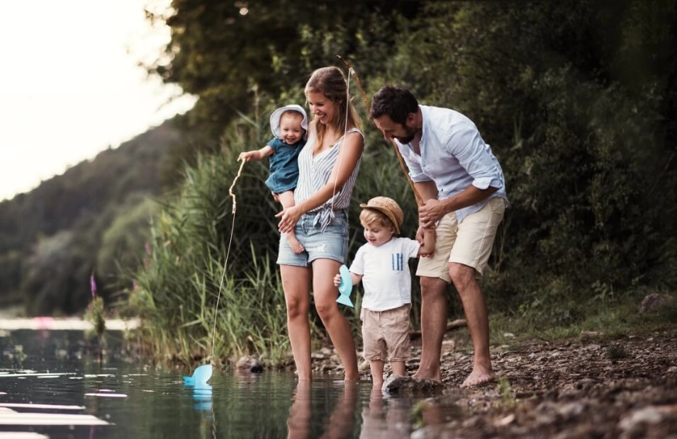 Family with young children enjoying time outdoors in a natural setting