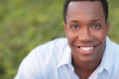 Man smiling after ozone dentistry treatment