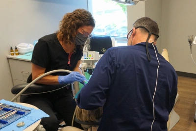 Dentist performing a restorative dentistry procedure on a patient