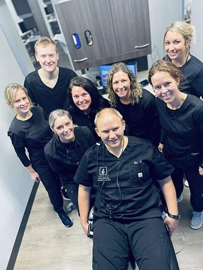 Northwest Natural Dentistry holistic dental team smiling together in the office