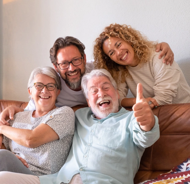 Happy family of three generations smiling after dental visit