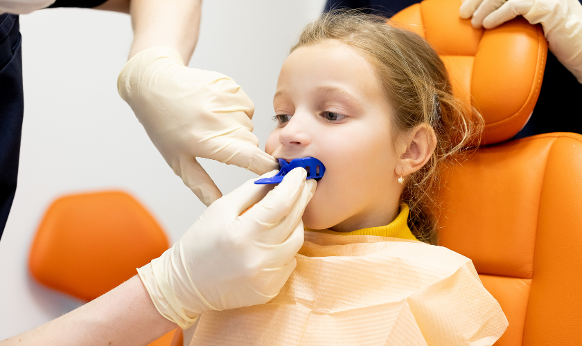 Child athlete getting mouthguard fixed at Premier Smiles of Bellevue, WA
