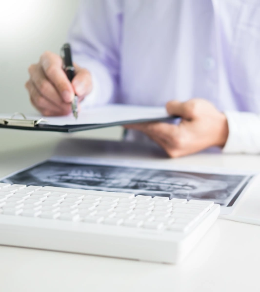 Office staff completing a dental insurance claim for a patient
