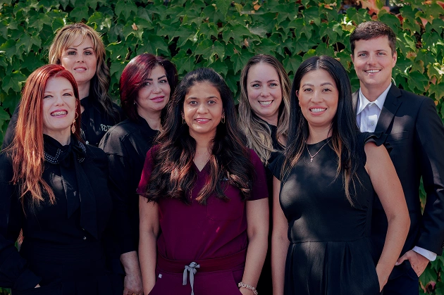 Dr. Purna Patel with the full dental team and office assistants posing for a group photo
