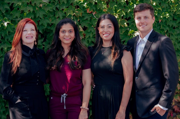 Dr. Purna Patel with team members Michael, Veronica, and Jenny in a group photo