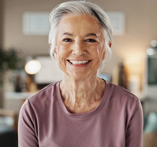 Smiling patient after successful dental implant treatment at Rocklin Comprehensive Dentistry in Rocklin, California.