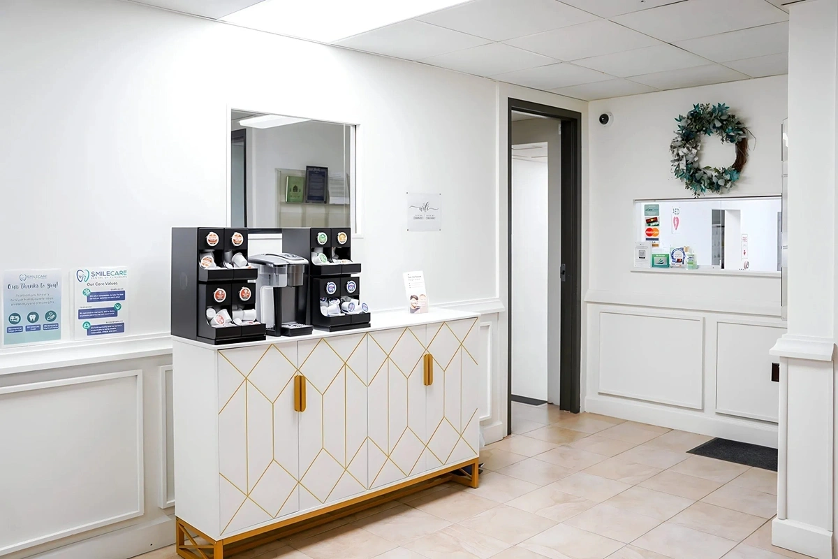Refreshment station and hallway view inside Rollstone Family Dental