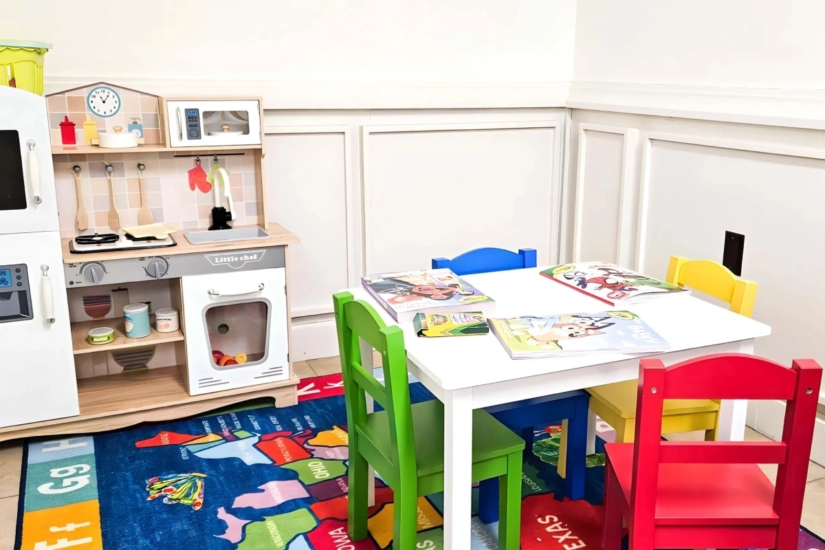 Kids play area with colorful chairs at Rollstone Family Dental