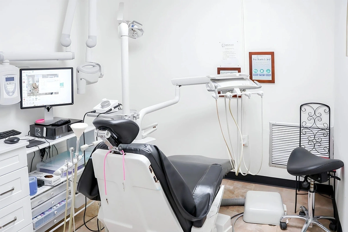 Modern dental treatment room with chair and equipment at Rollstone Family Dental