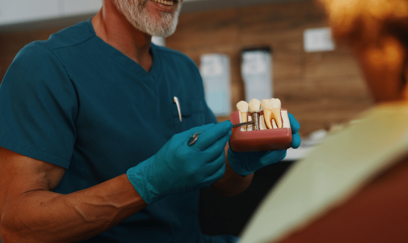 Patient smiling confidently after dental implant treatment in Charlottesville VA dental office
