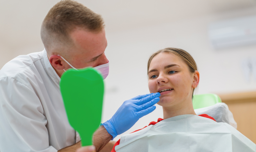 Patient experiencing tooth sensitivity from cold winter air in New York City seeking dental care