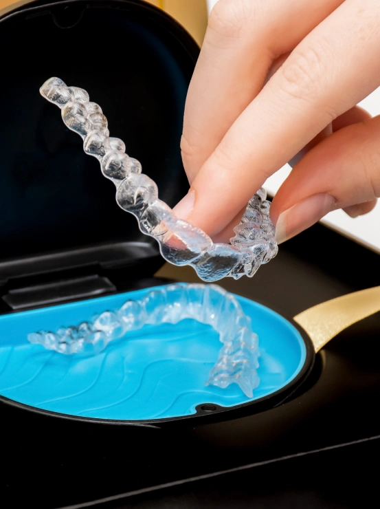 Invisalign clear aligners and storage case for discreet orthodontic teeth straightening treatment