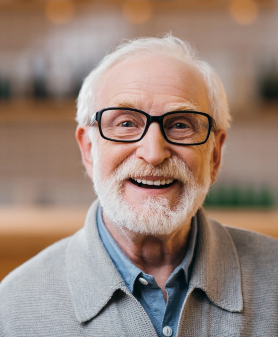 Smiling patient with restored teeth after receiving custom dentures at South Arlington Smiles in Arlington, TX.