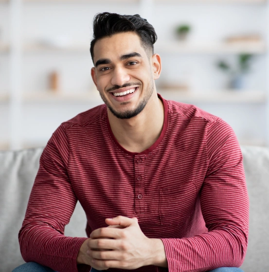 A happy patient smiling confidently, highlighting restorative dentistry services at South Arlington Smiles.