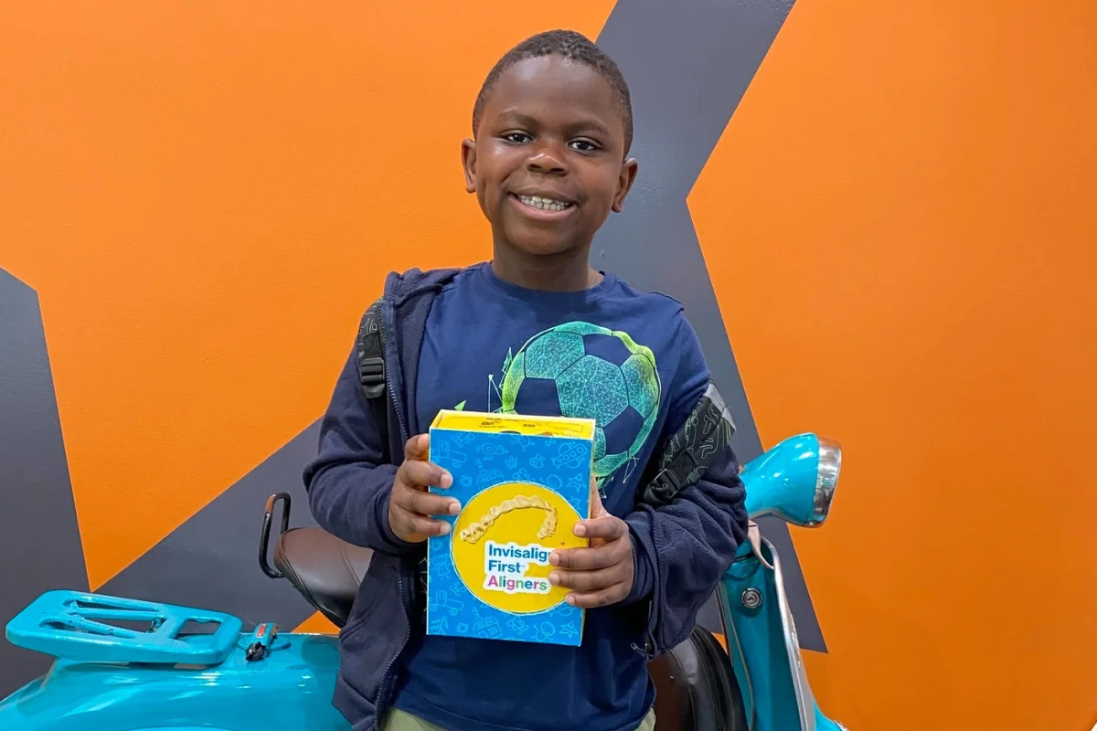 Young boy smiling at an orthodontic office