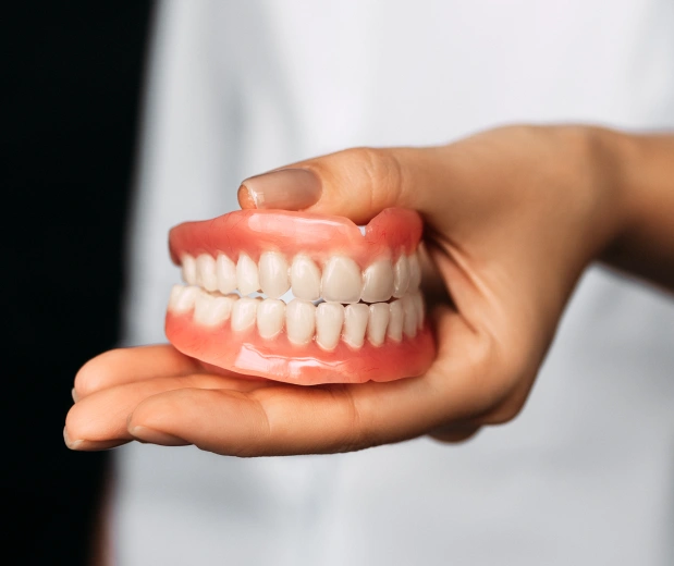 Custom dentures in Manhattan, NYC at Stuyvesant Dental, designed for comfort, function, and a natural appearance.