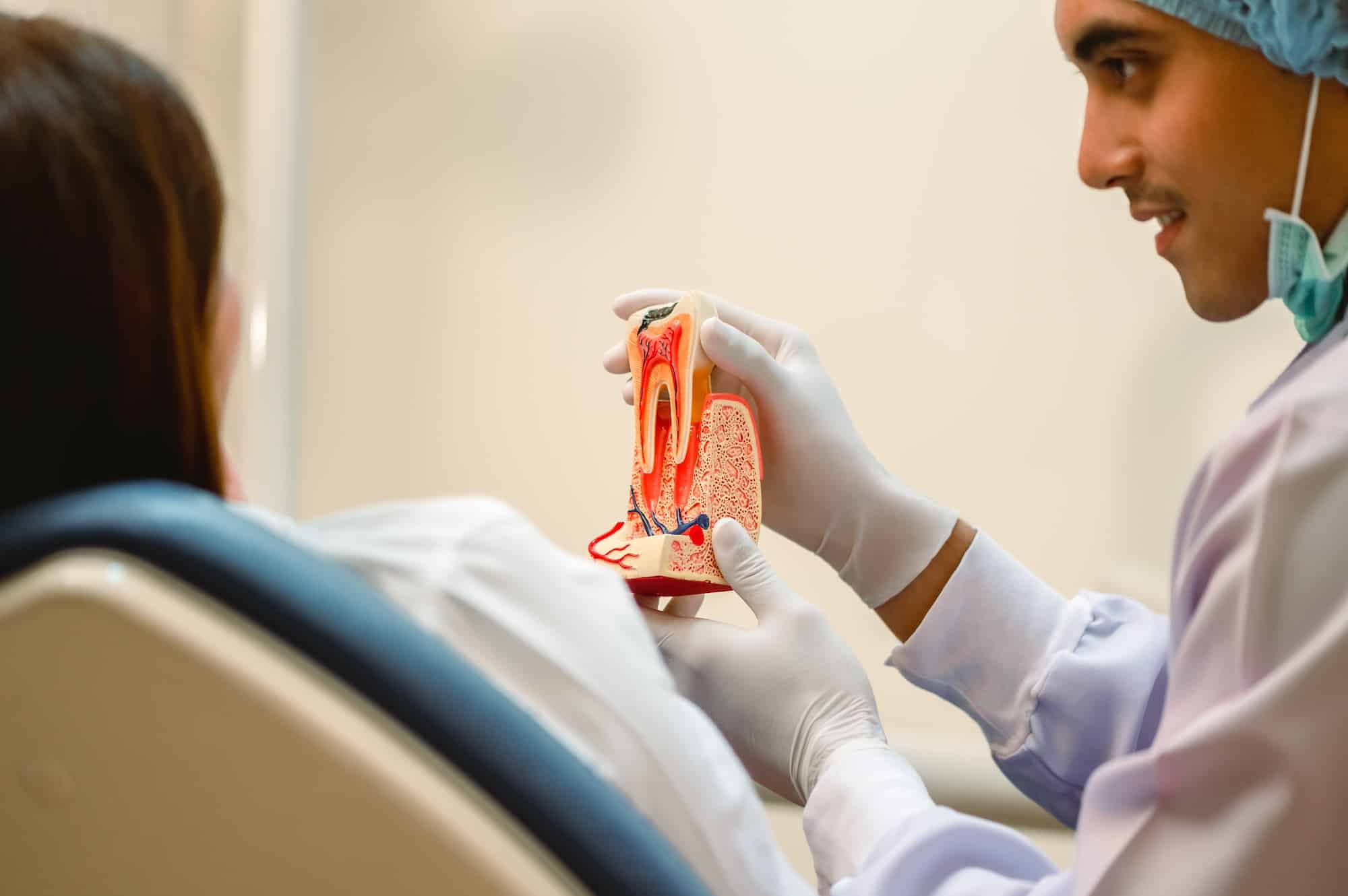 dentist explaining root canal for pain