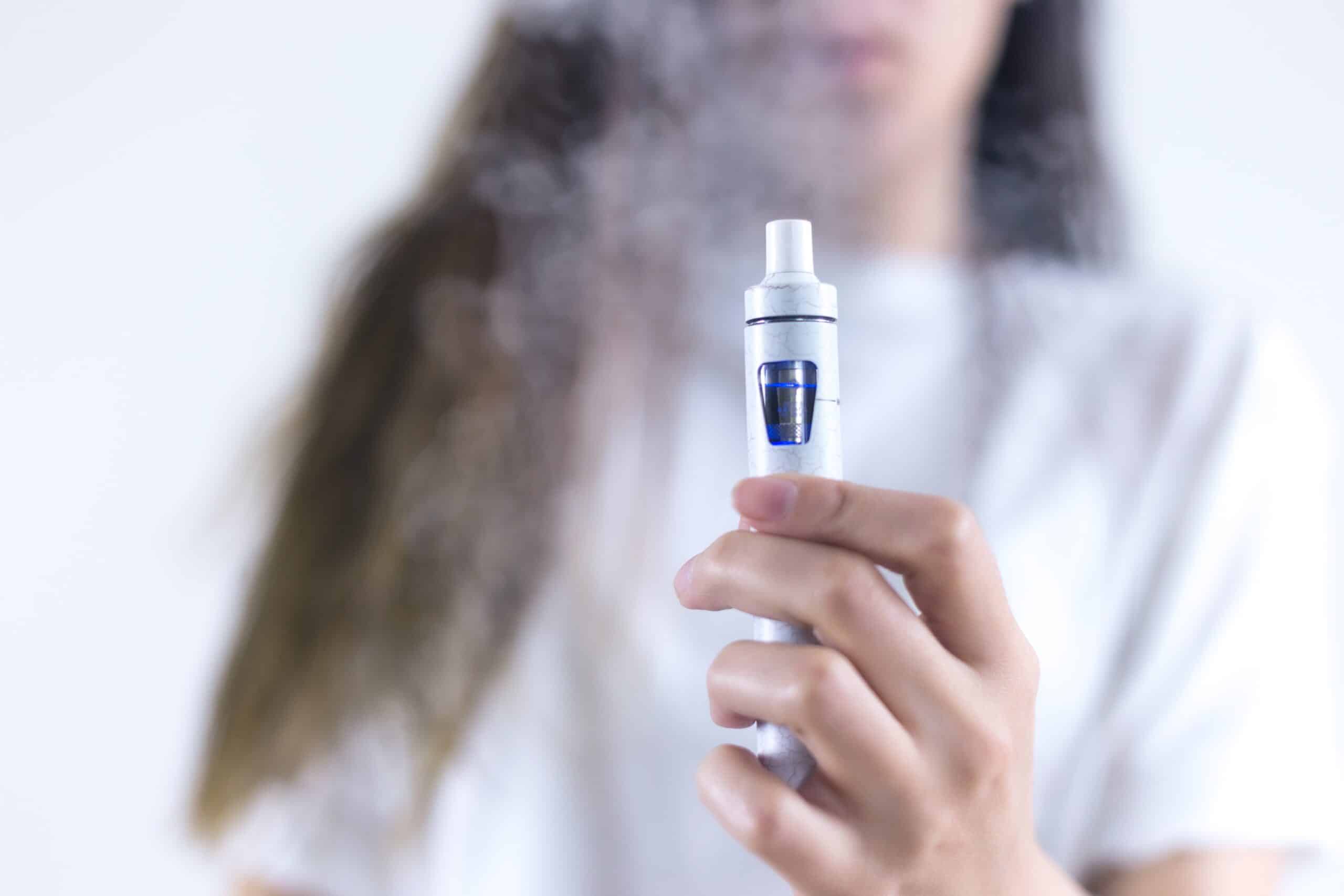 Woman holding a vaping product