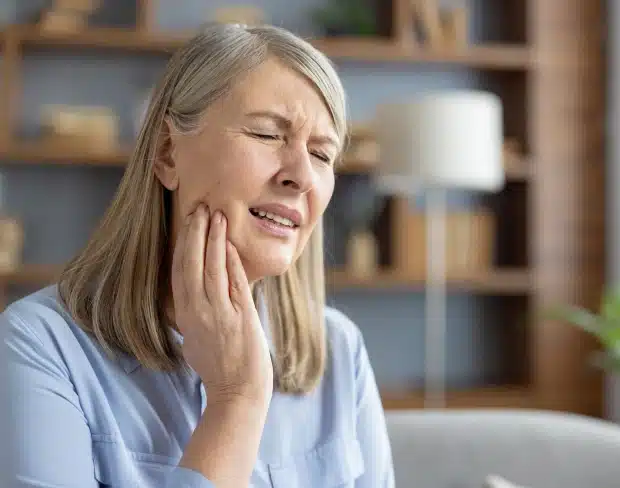 Woman receiving emergency dental care in a treatment room at Thrive Family Dentistry of Auburn in Auburn, AL