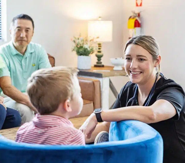 Dental team member reviewing treatment with young patient and parent at Thrive Family Dentistry