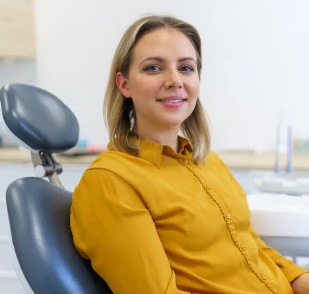 Female patient smiling in dental chair at Thrive Family Dentistry Auburn AL