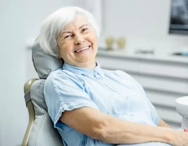 Woman seated in a dental chair for root canal therapy during a visit at Thrive Family Dentistry of Auburn in Auburn, AL
