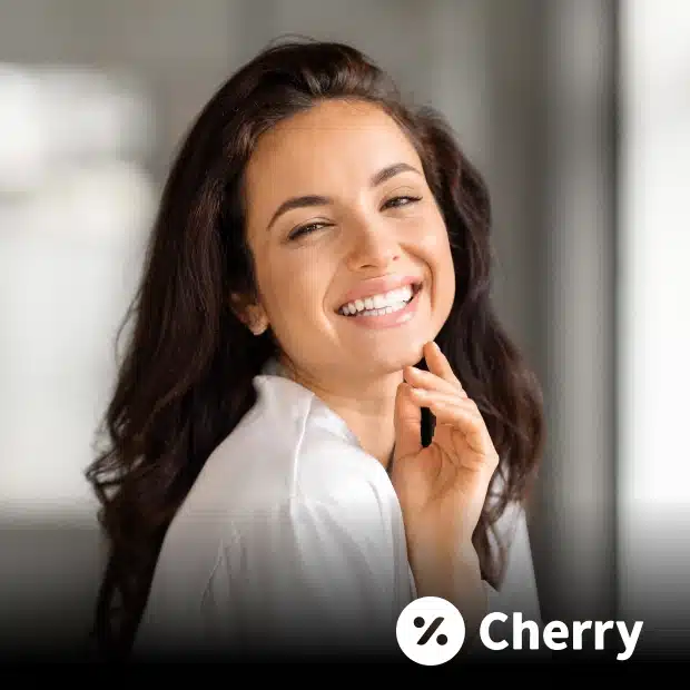 Woman smiling and touching her chin