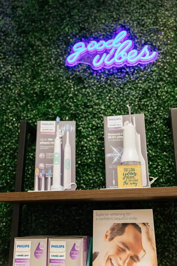 Good Vibes neon sign and oral care product display at TRU Dentistry SoCo in South Austin, TX