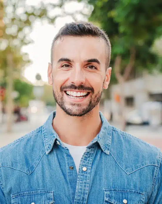 Man with bright white smile after professional teeth whitening at TRU Dentistry SoCo in South Austin, TX