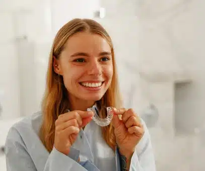 A happy patient after getting clear aligners at Valley Dental Riverview