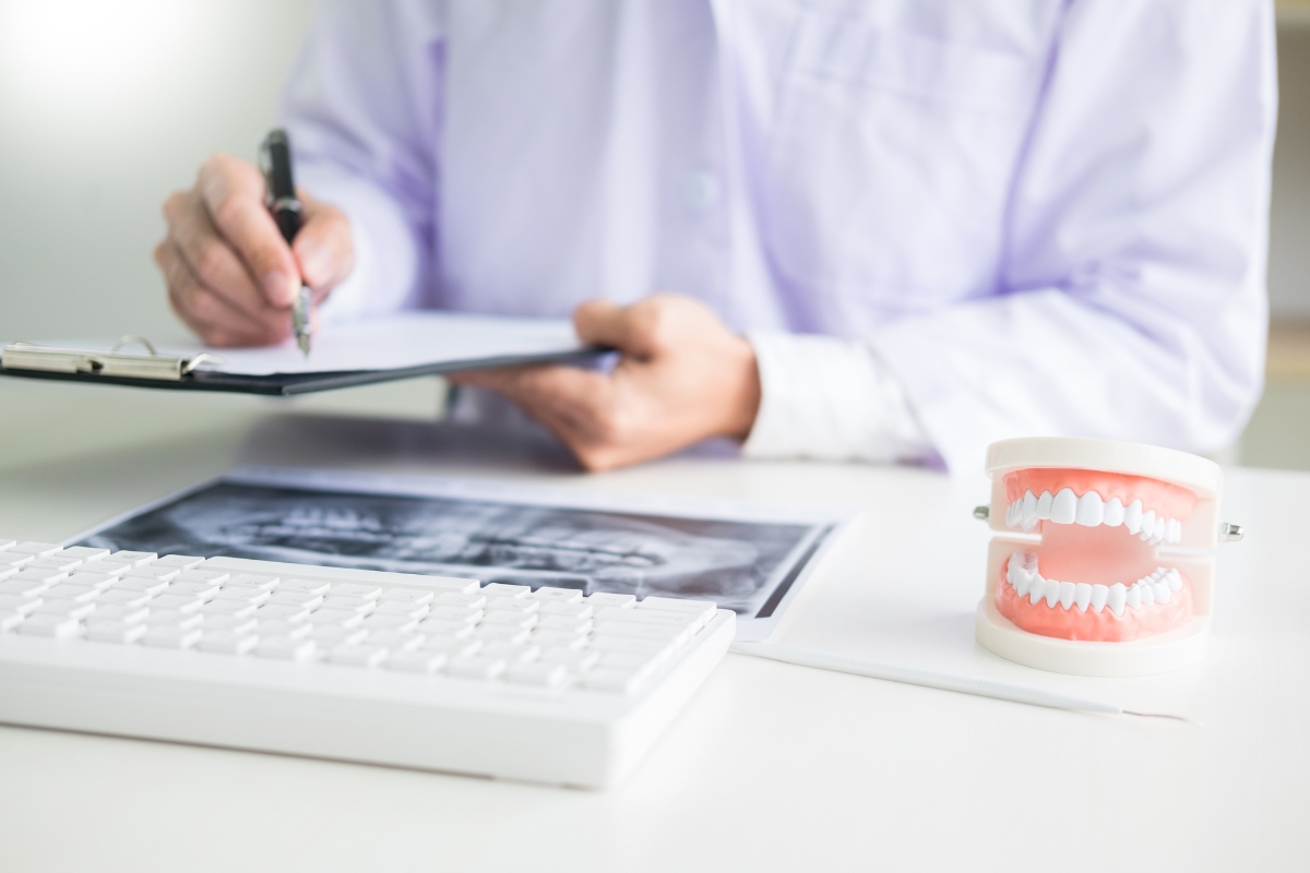 Dental insurance verification specialist reviewing patient insurance eligibility and benefits for a dental practice using Verifixed's fast and accurate verification services.