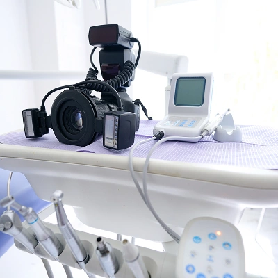 Professional dental photography equipment set up in a modern dental operatory