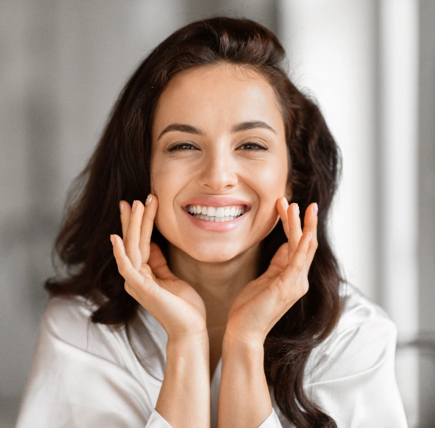 Woman showing a bright, confident smile after cosmetic dentistry treatment in Holland, PA