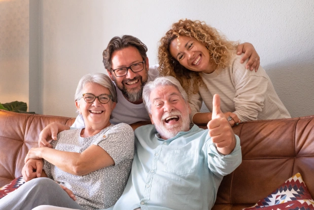 Happy family smiling together representing patient-focused dental care