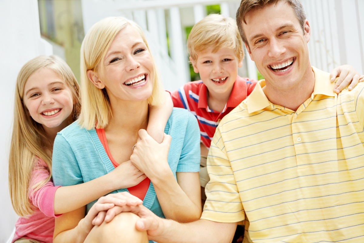 Happy family highlighting the benefits of family dental care for every generation